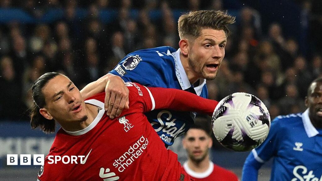 Darwin Nunez and James Tarkowski challenge for the ball