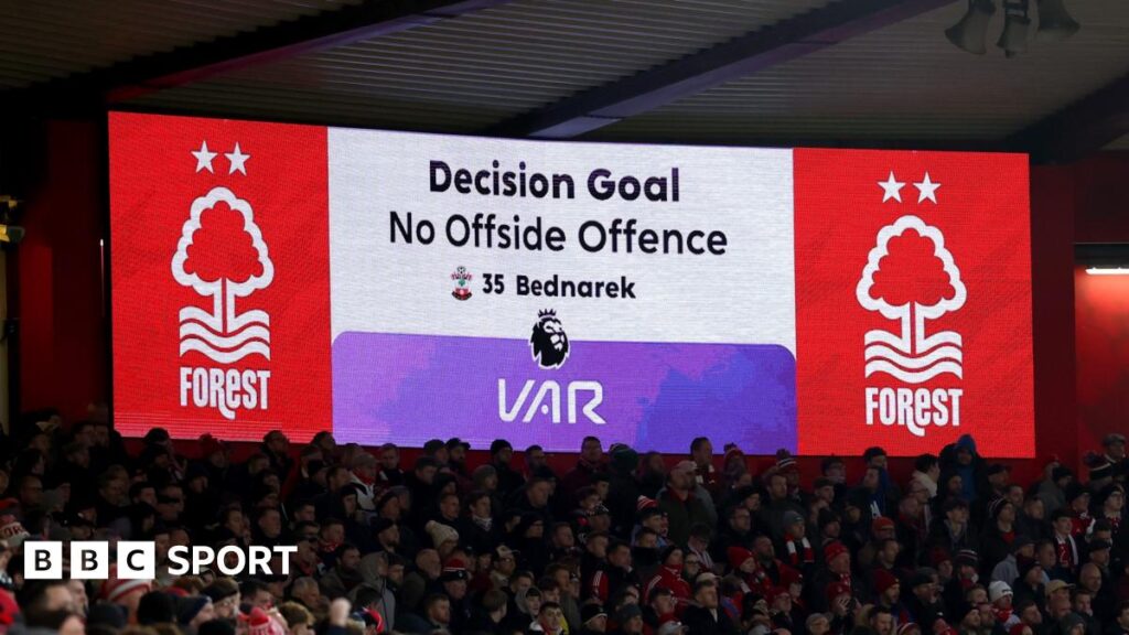 A screen displays a VAR decision during Nottingham Forest