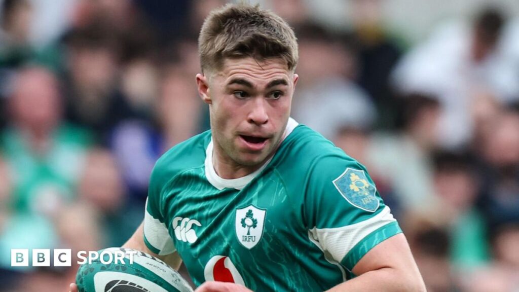 Jack Crowley runs with the ball during Ireland